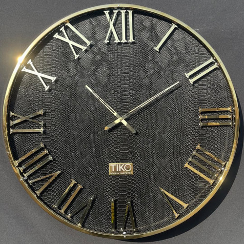 ساعت دیواری چرم پوست ماری براق و استیل طلایی